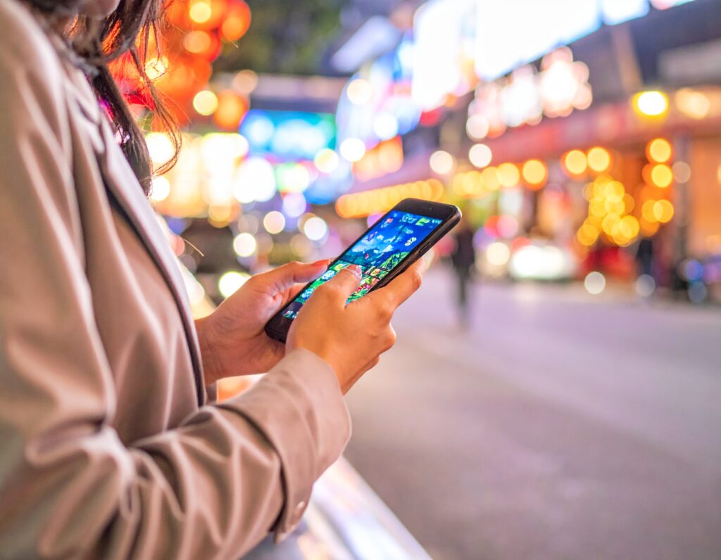 Someone playing a mobile game on a smartphone.